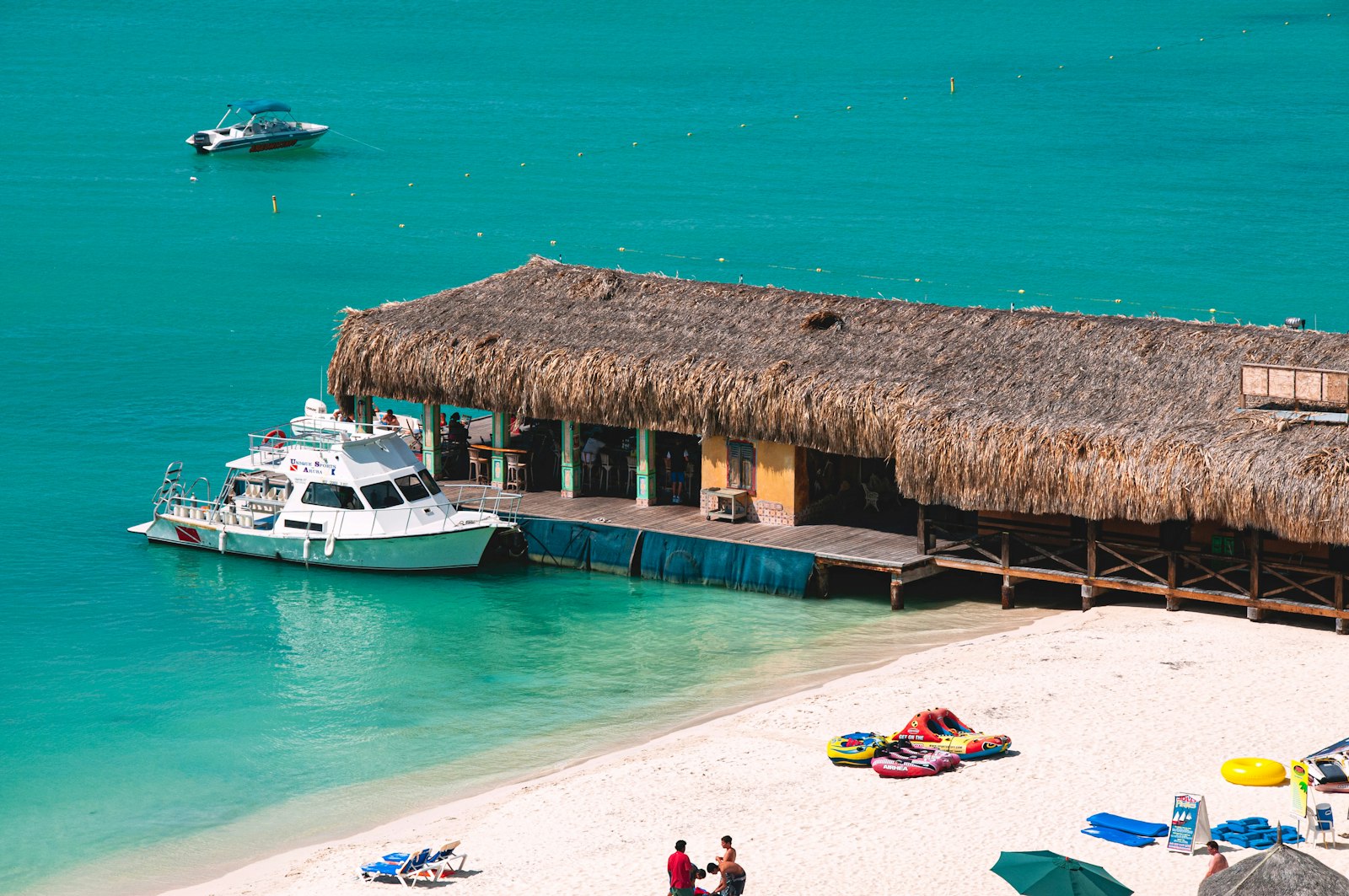 Tropical beach resort with turquoise water and luxury amenities